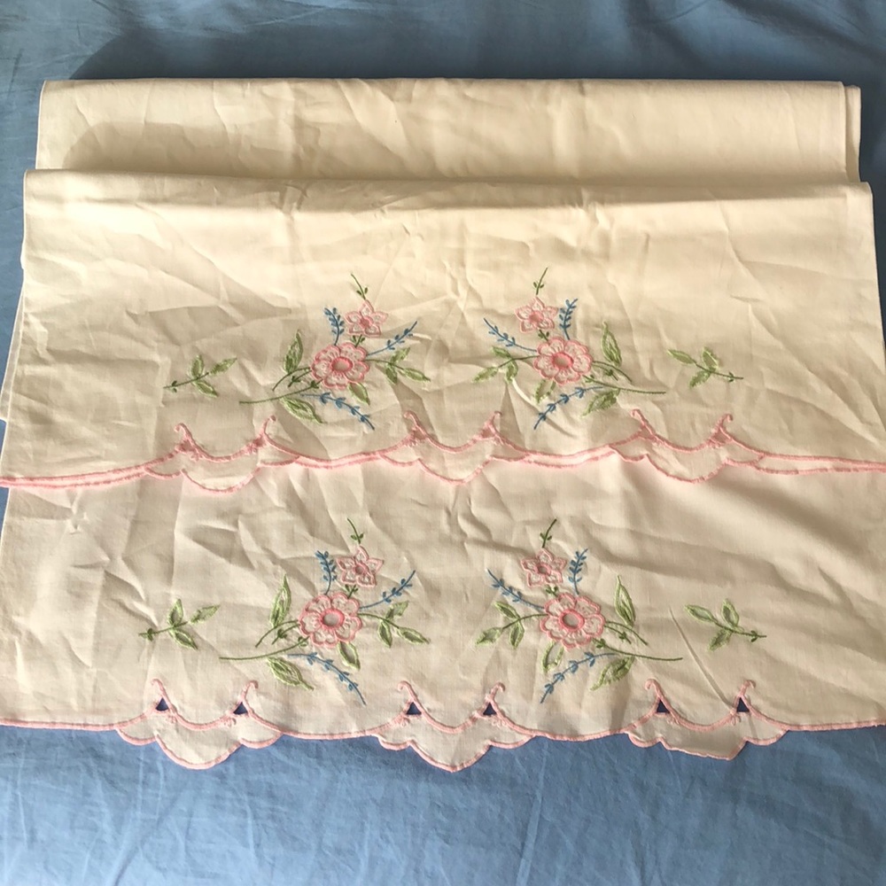Two embroidered pillow cases